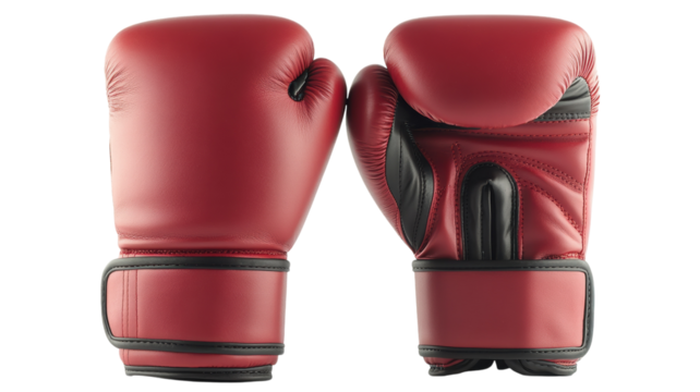 Red boxing gloves ready for action in a gym setting