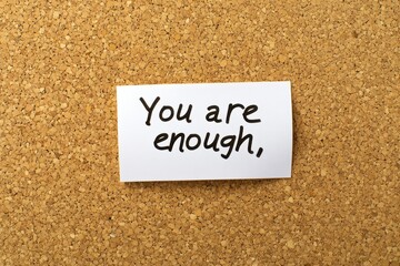 Inspirational Message on Paper with Corkboard Background