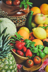 rustic composition of mixed fruits and vegetables viewed from above