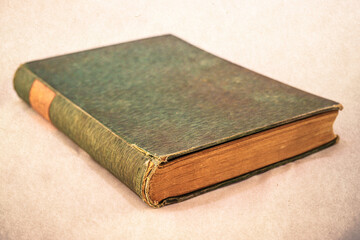 Old book isolated on a white background. Old damaged book close up.