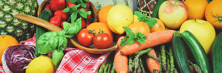 rustic composition of mixed fruits and vegetables viewed from above