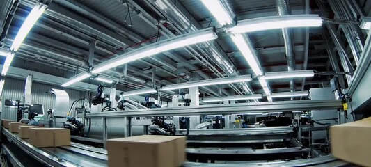 Automated conveyor system sorting packages in hightech warehouse