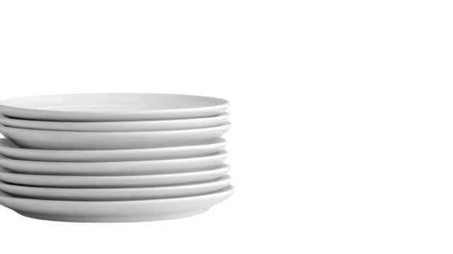Stacked white plates ready for a delightful dining experience in a cozy restaurant