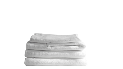 Soft and fluffy white towels neatly stacked in a serene bathroom setting