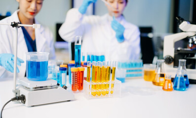 Fototapeta premium Young scientists conducting research investigations in a medical laboratory, a researcher