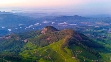Breathtaking Drone Perspective of Munnar’s Verdant Hills with tea garden