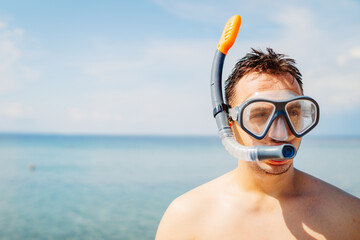 Portrait of young caucasian man with scuba diving mask 
