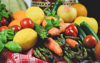 rustic composition of mixed fruits and vegetables viewed from above