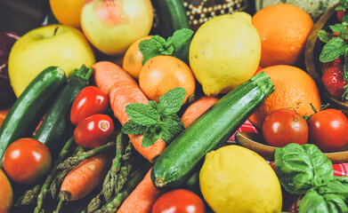 rustic composition of mixed fruits and vegetables viewed from above