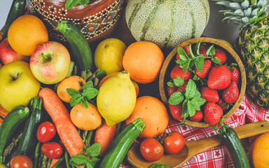rustic composition of mixed fruits and vegetables viewed from above