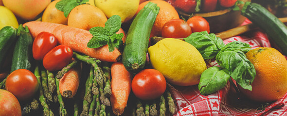 rustic composition of mixed fruits and vegetables viewed from above