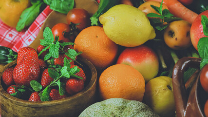 rustic composition of mixed fruits and vegetables viewed from above