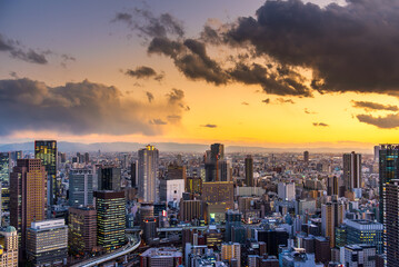 Osaka city Japan skyline building Umeda district cityscape at sunset.