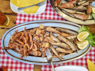 A delicious Mediterranean dish of fried srimps, squids and small fish served in a small restaurant in the town of Split on the Croatian riviera
