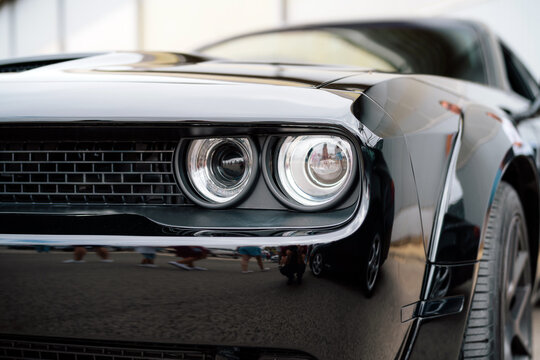 Fototapeta Close-Up of a Black Vintage Car Headlight and Front Design