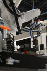 Modern robotic arm performing tasks on an automated production line in a high-tech factory