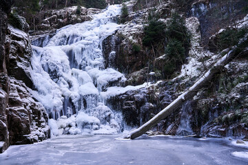 Frozen Kamieńczyk Waterfall in Winter in the Karkonosze Mountains