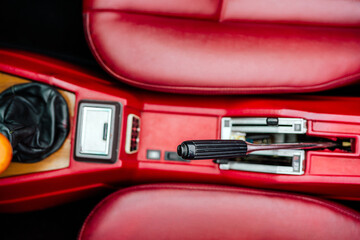 Red Car Interior Featuring Handbrake and Gear Stick in Close-Up View