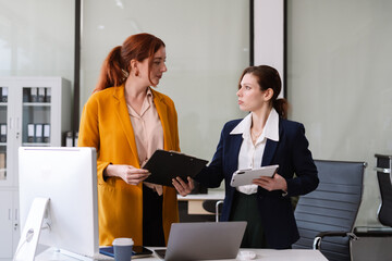 Diverse professionals brainstorming, planning strategy having a discussion Analysis investment researching.