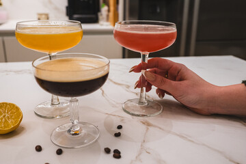 Homemade Margaritas and Espresso Martini with Friends on a Marble Countertop