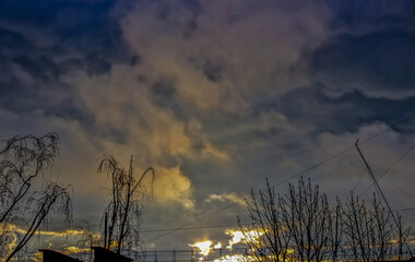 time lapse of clouds over sunset