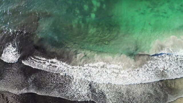 The turquoise beach of Son Saura in Menorca, with rough seas Balearic Islands
