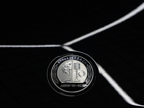 AMG Affalterbach logo on a black background, close-up. AMG Affalterbach nameplate on the hood of the luxury Mercedes-Benz S63 S-class W223 V8 biturbo.