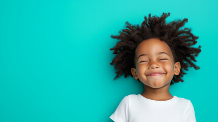Playful Child Winking with a Mischievous Smile on a Teal Background