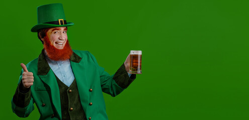 Leprechaun elf on St. Patrick's Day. Cheerful character Irish leprechaun for advertising with a red...
