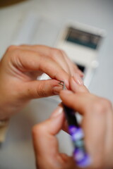 Fototapeta premium Beautician is preparing false eyelashes to apply