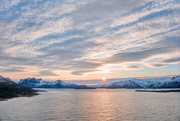 aerial photo of a wintry coastal landscape in the Bergsfjorden near Skaland on the Island of Senja in northern norway
