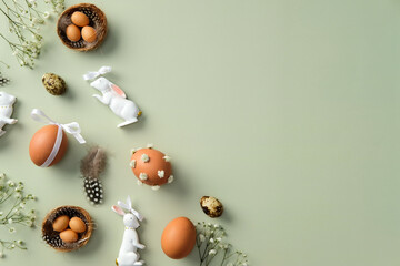 Happy Easter concept. Flat lay composition with decorated Easter eggs, gypsophila flowers, Easter...