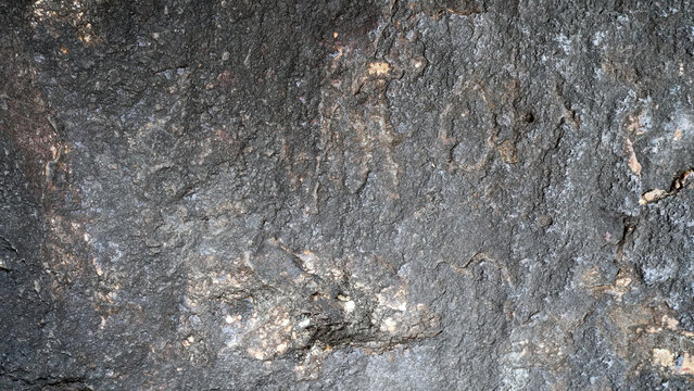 Magnetite iron ore texture close-up. Contains magnetit, pyrite, calcite, magnesioferrite, spinel, fluorite. Siberian natural resources deposit. Mineral stone surface background.