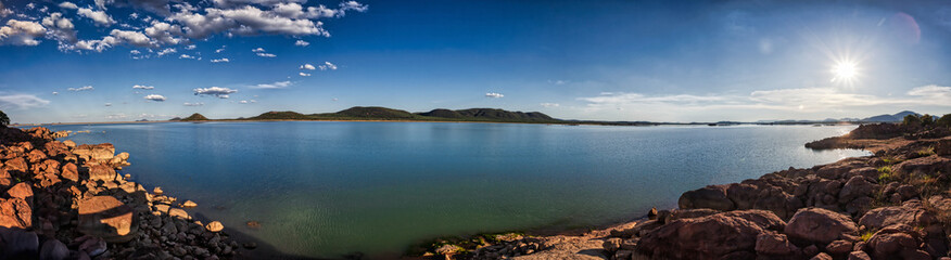 Gaborone dam panorama in Botswana view at sunset, unspoiled nature , conservation area, lens flare