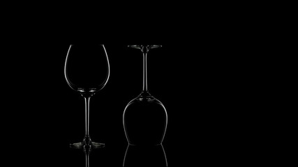 Elegant Wine Glasses with Dramatic Lighting on Black Background
