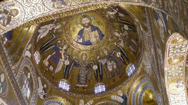 Gimbal shot reveals spectacular dome covered with colorful mosaics in Palatine Chapel in Palermo's Norman Castle, historic landmark in Italy
