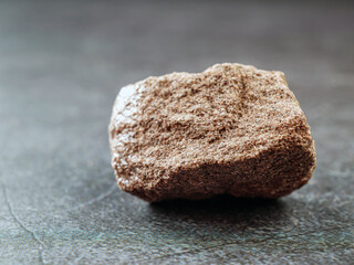 Close-up of sandstone on gray background