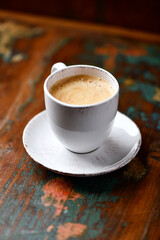 Cup of coffee on wooden background. Soft focus. Copy space
