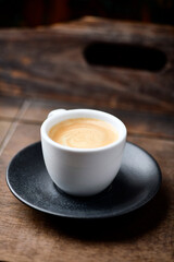 Cup of coffee on wooden background. Soft focus. Copy space