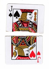 A vintage picture playing card made up of torn halves on a white background.