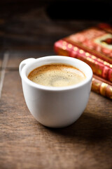 Cup of coffee on wooden background. Soft focus. Copy space