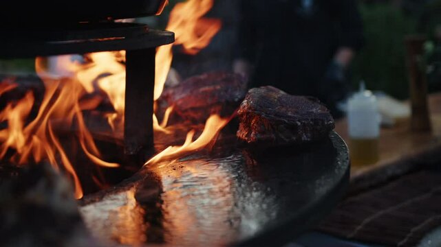 Juicy steaks sizzle as flames dance in a tranquil outdoor environment. Friends gather around, sharing laughter and delicious food during a beautiful sunset.