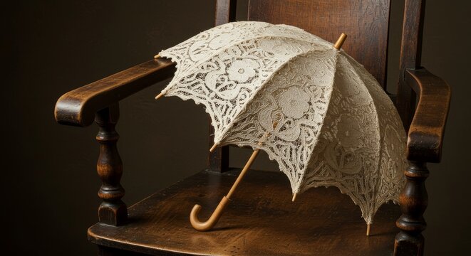 Delicate lace parasol resting gracefully upon a vintage wooden armchair