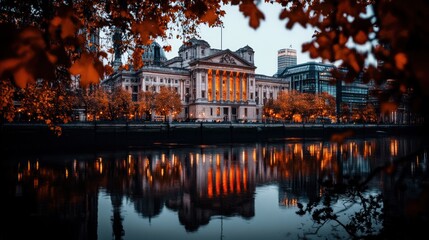 Fototapeta premium Elegant Building Reflection in a Serene River at Dusk