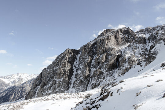 Serene winter landscape of snow-covered mountains and wide open space. Remote wilderness, crisp air and tranquil natural surroundings.