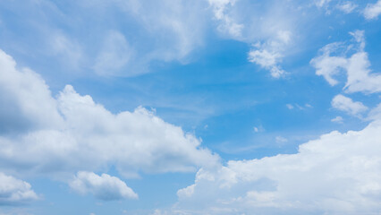 Vast Blue Sky with Billowing White Clouds