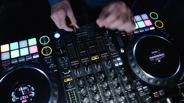 An electrifying atmosphere fills the nightclub as a skilled DJ mixes tracks seamlessly. Colorful lights pulse to the beat, energizing the crowd in a lively night scene.