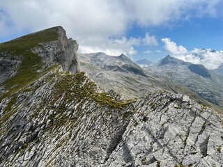 Alpine peaks Chli Hohmad (2492 m) and Gross Hohmad (2307 m) above the Tannensee lake (or Tannen lake) and in the Uri Alps mountain massif, Melchtal - Canton of Obwalden, Switzerland (Kanton Obwald)