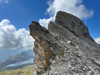 Alpine peaks Chli Hohmad (2492 m) and Gross Hohmad (2307 m) above the Tannensee lake (or Tannen lake) and in the Uri Alps mountain massif, Melchtal - Canton of Obwalden, Switzerland (Kanton Obwald)
