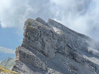 Alpine peaks Chli Hohmad (2492 m) and Gross Hohmad (2307 m) above the Tannensee lake (or Tannen lake) and in the Uri Alps mountain massif, Melchtal - Canton of Obwalden, Switzerland (Kanton Obwald)